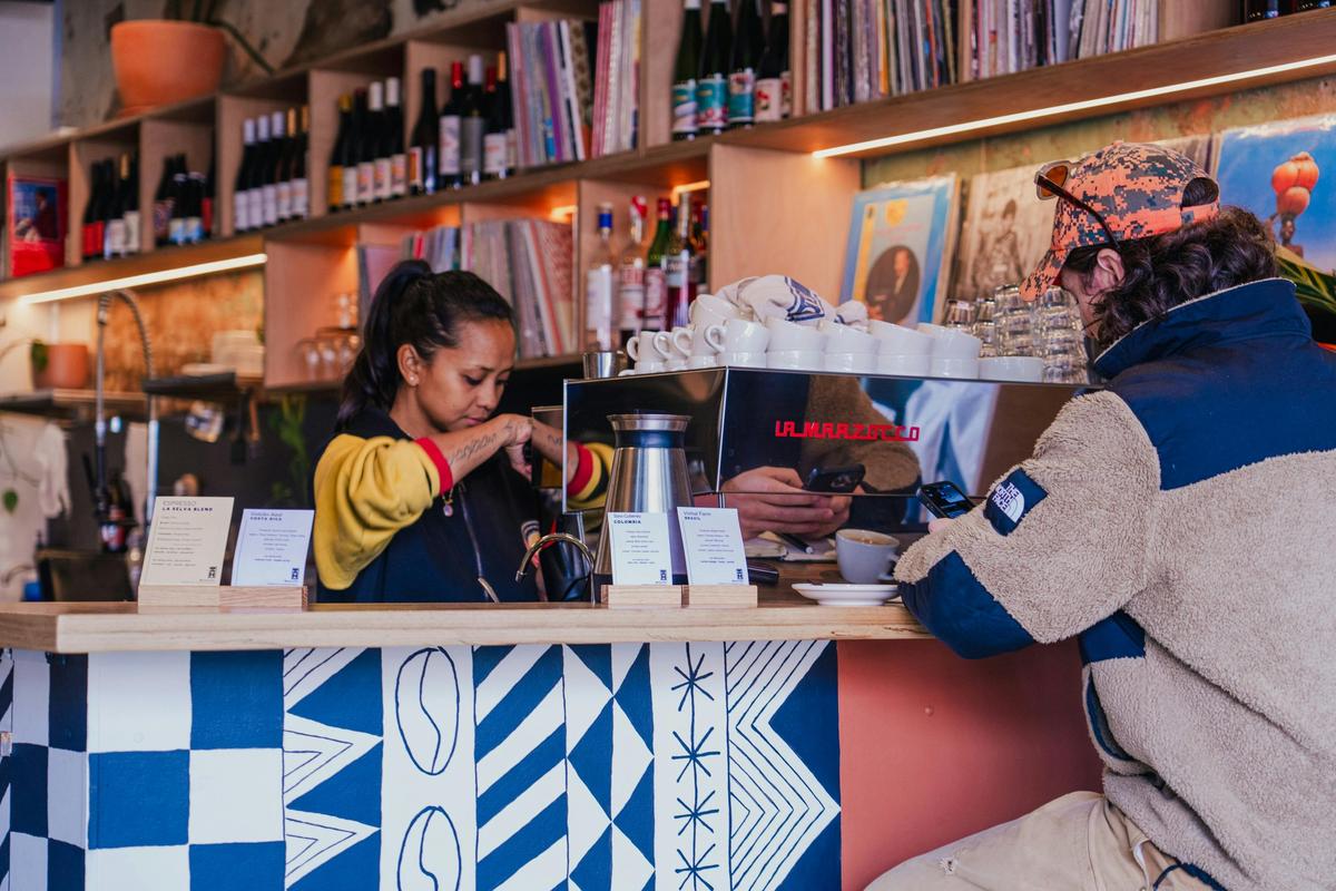 Barista serving coffee