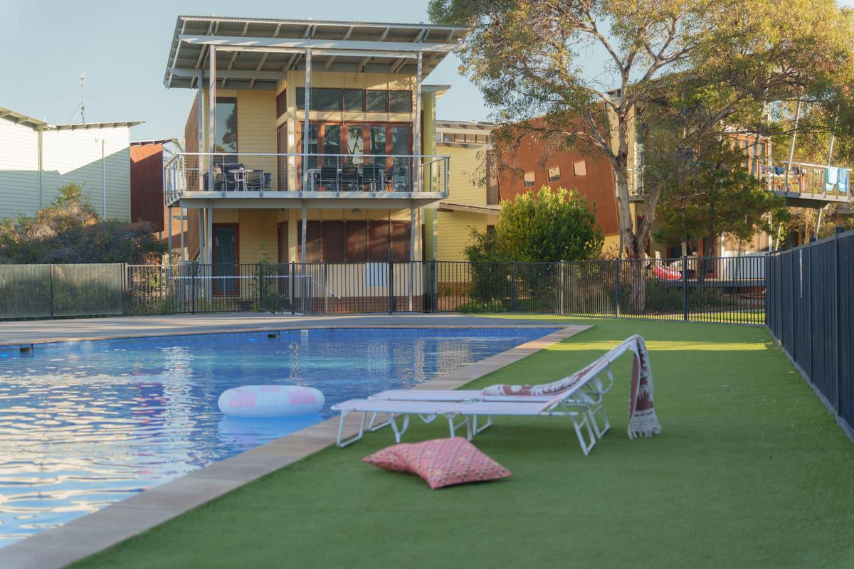Enjoy a dip in the large community pool - only meters from The Shores villas