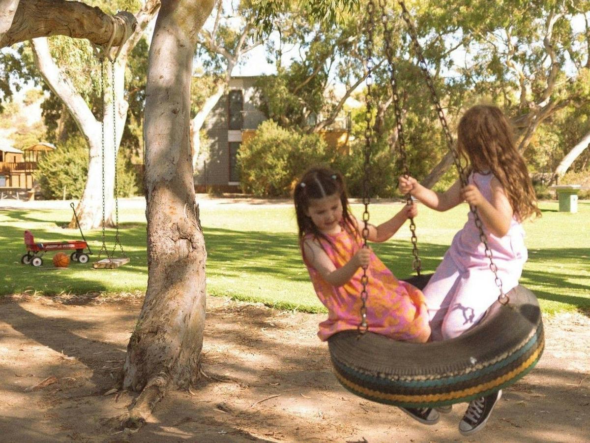 The kids can experience the joy of a tyre swing when they stay in a villa by The Shores