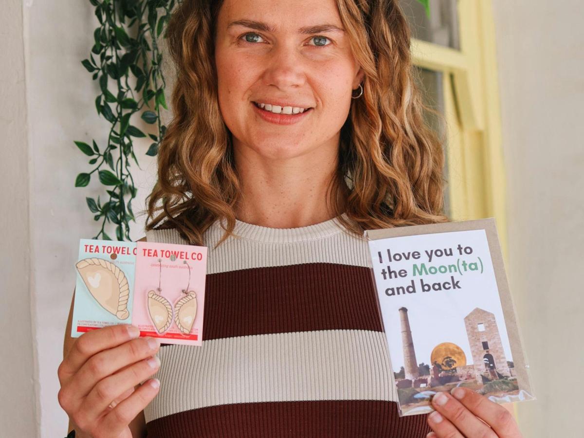 The Moonta Collective owner Jacqui with a selection of the store’s fun and unique greeting cards.