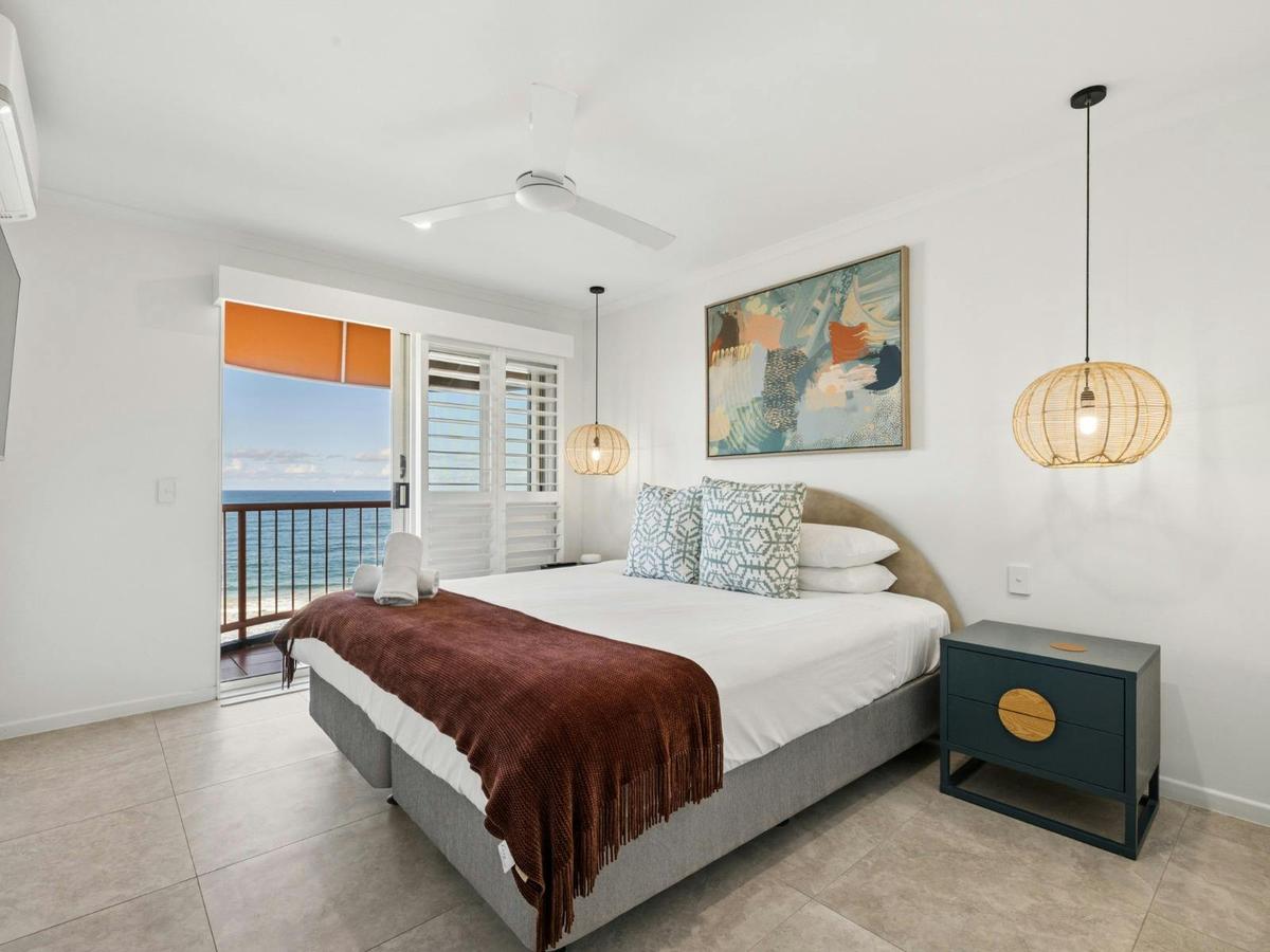 Main bedroom with King bed, ensuite bathroom and private balcony