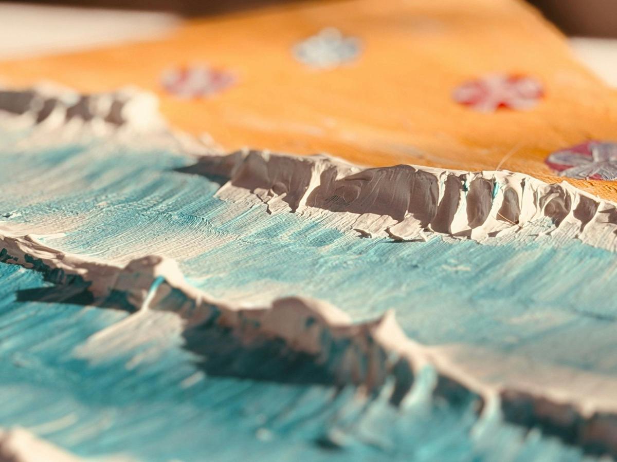 Raised texture paste ridges catching the light across the canvas