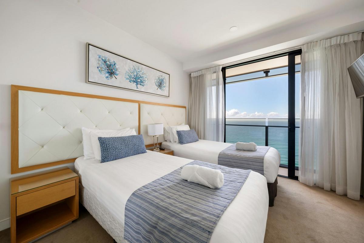 Bedroom two takes two single beds and has its own balcony.