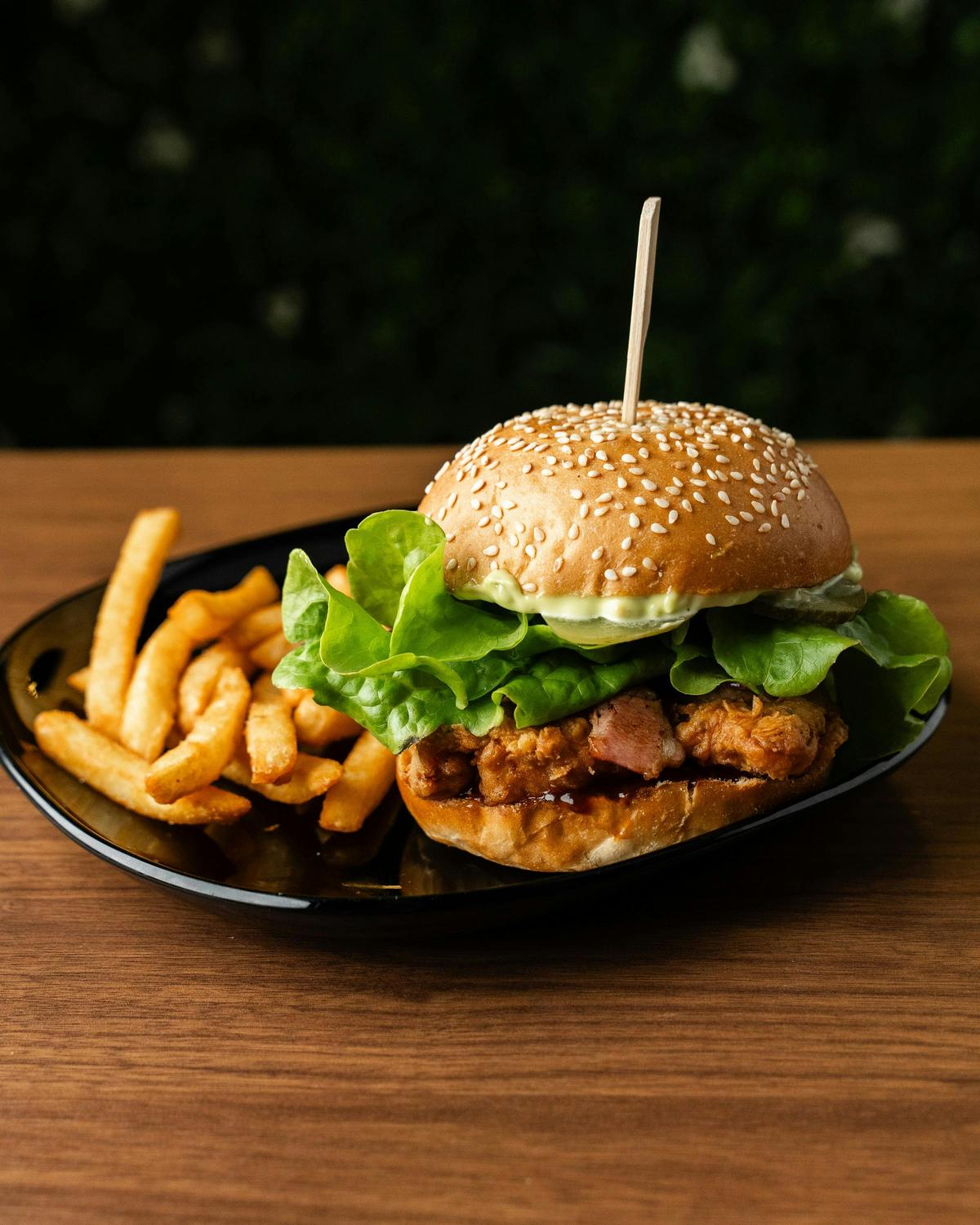 Chicken burger served with crispy fries.