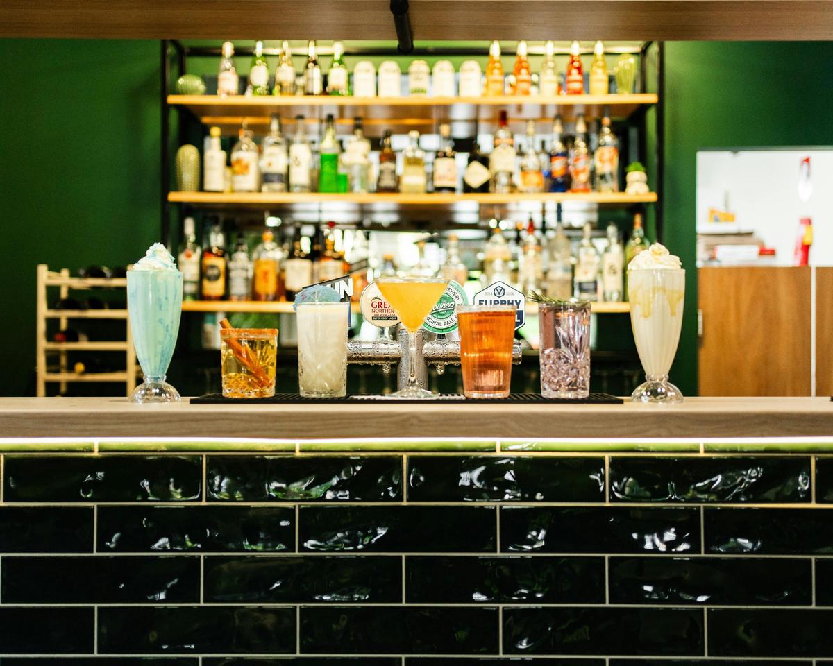 A well stocked bar area with a range of drinks.