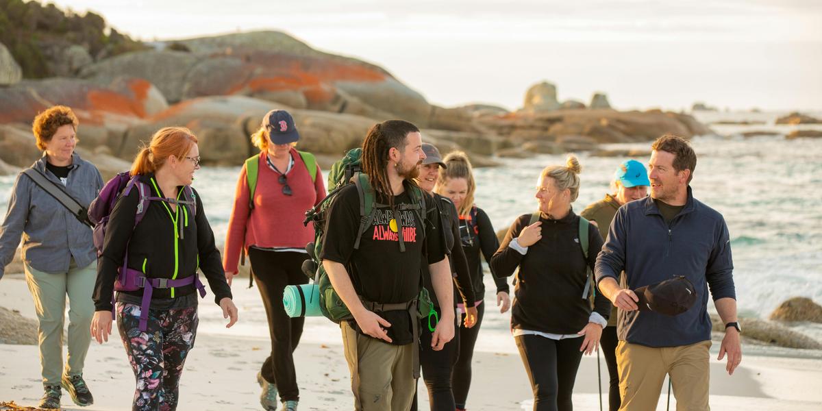 wukalina Walk guide Cody Gangell leads guests south along the coastline towards larapuna