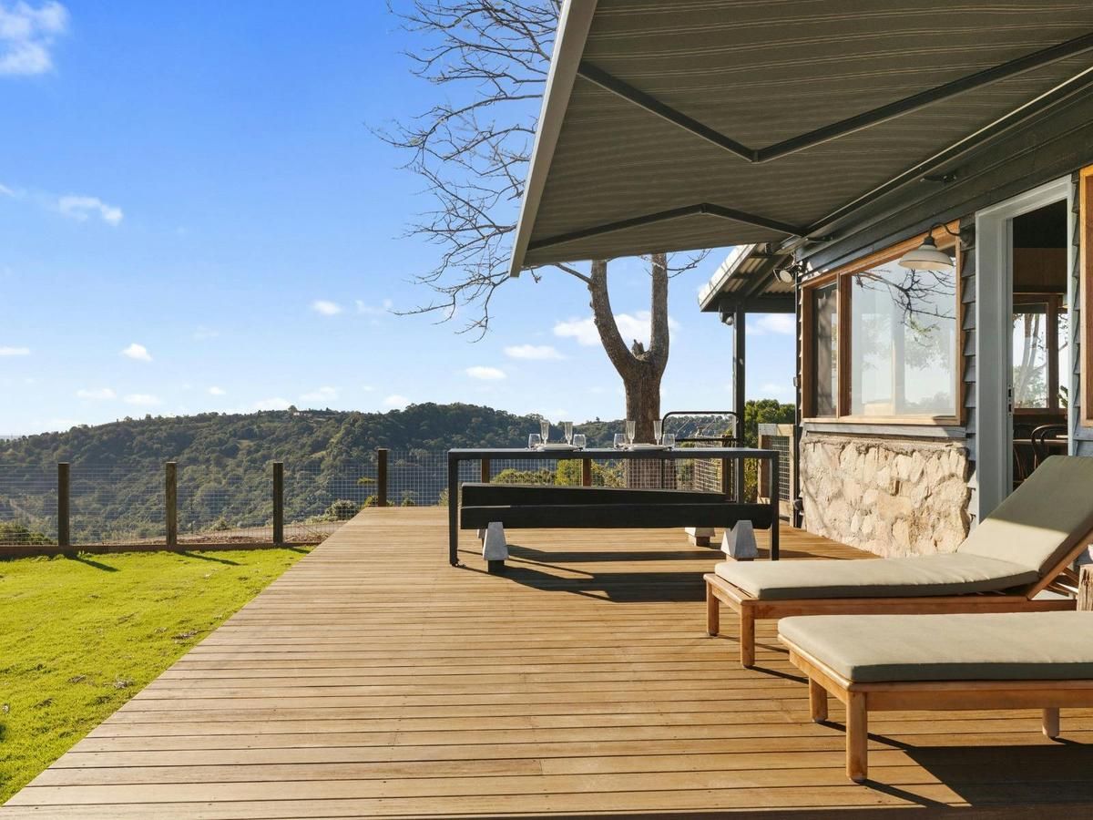 Balcony area with outdoor dining and sunlounges