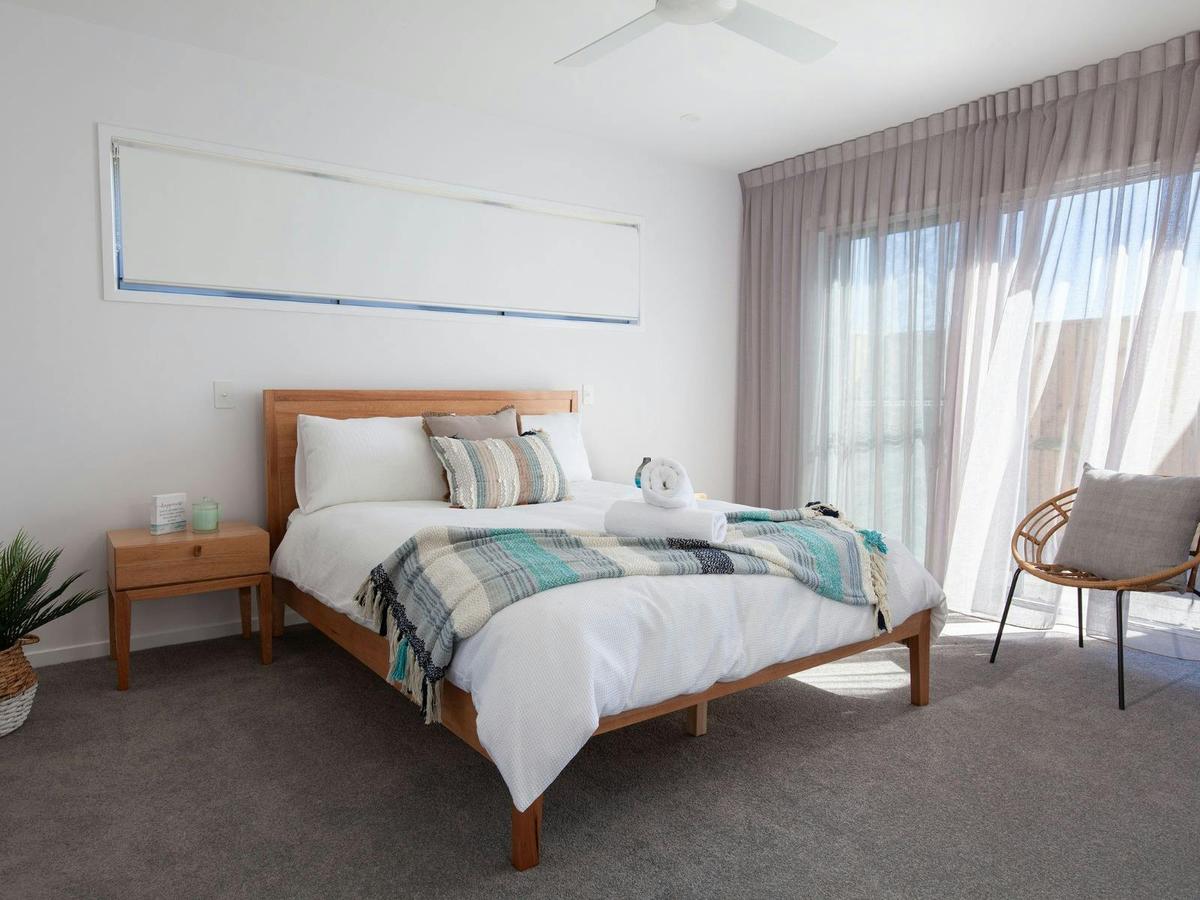 Main bedroom with queen bed and ensuite bathroom