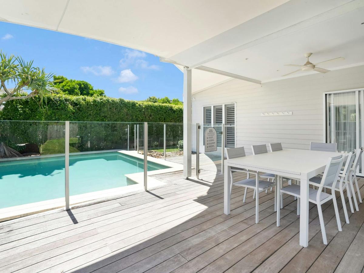 Balcony with outdoor dining, BBQ and pool area