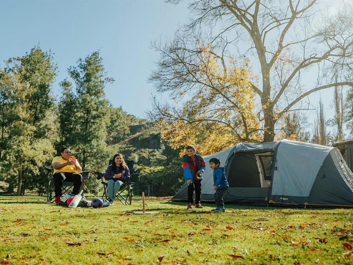 Parents watch their 2 sons playing at Wombeyan Caves campground. Credit: Remy Brand/DPE &copy; Remy