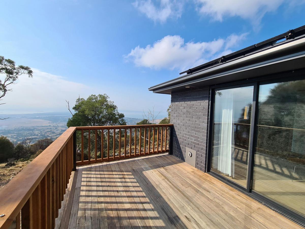 Private deck surrounded by Tasmanian bushland