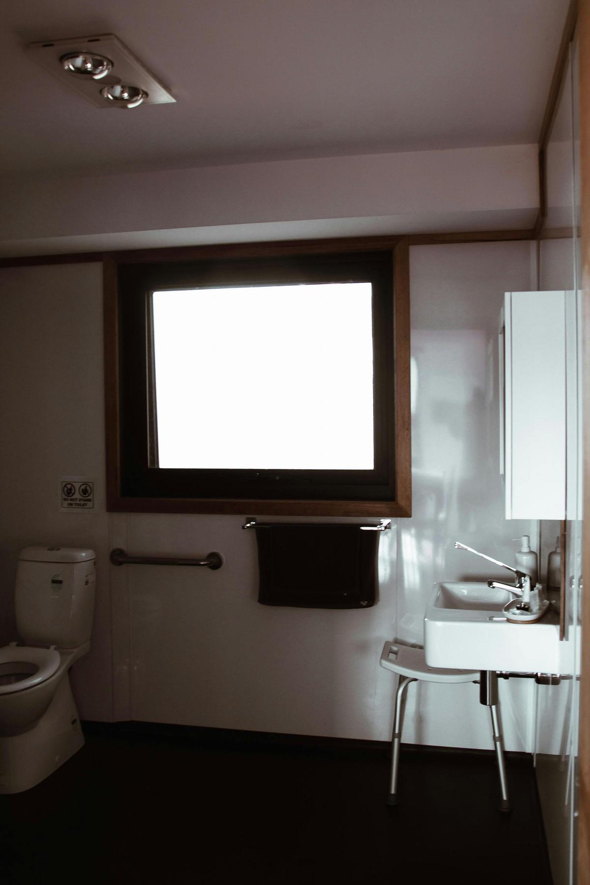 Accessible bathroom with walk-in shower and grab rails