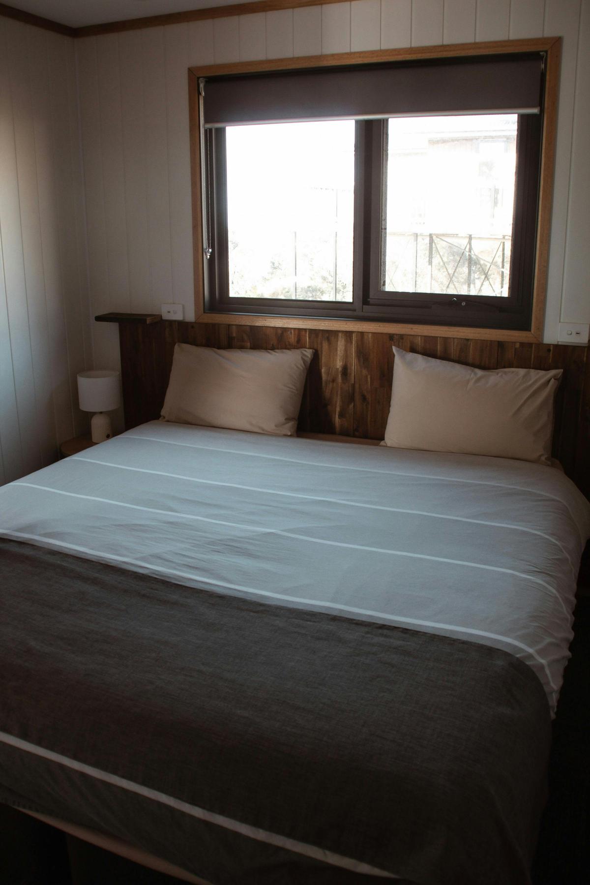 Comfortable bedroom with queen bed and mountain views