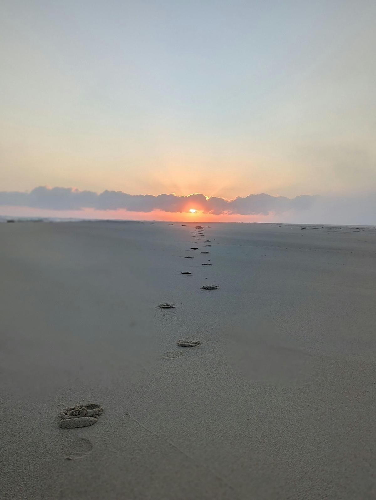 Walking on the sand towrds a stunning NSW South Coast Sunrise