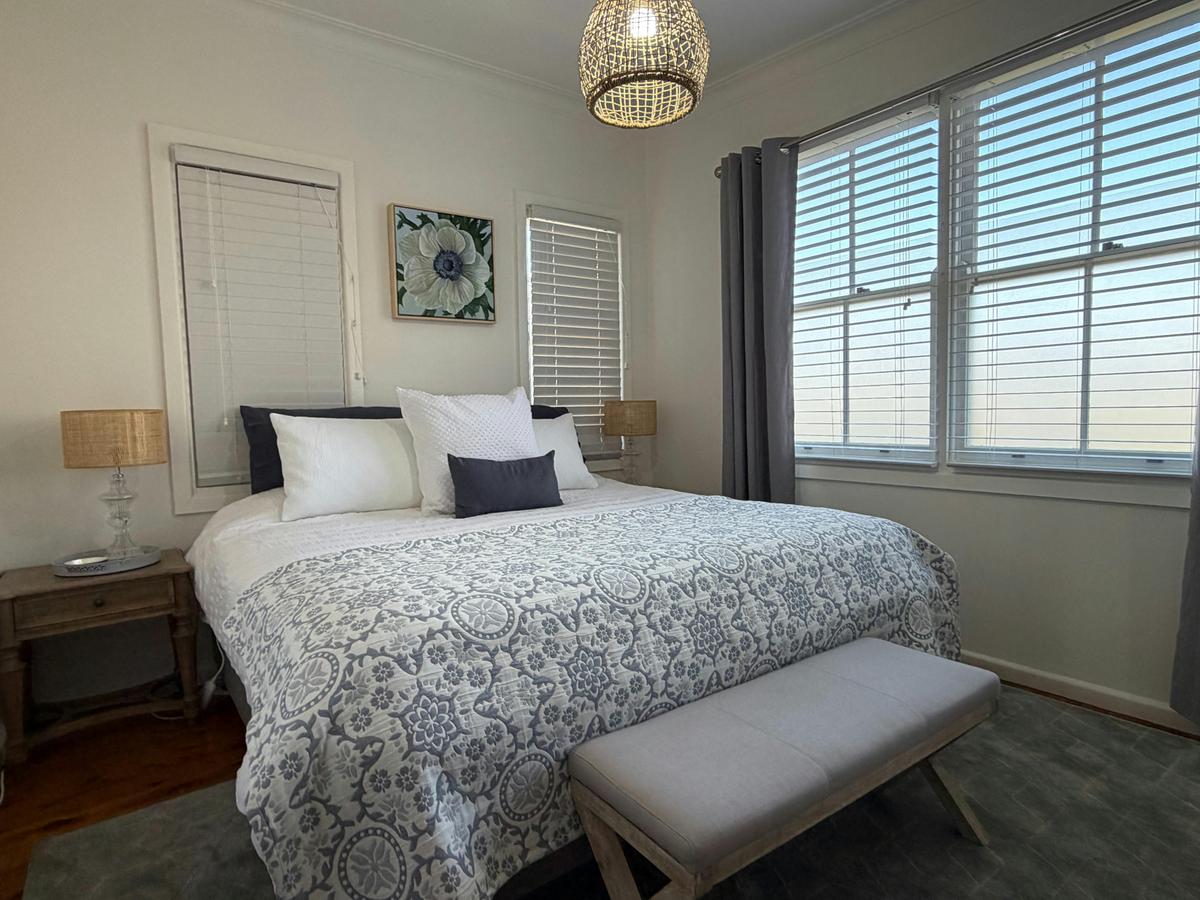 King Bedroom with ensuite, electric blanket, iron, ironing board, organic bed linen