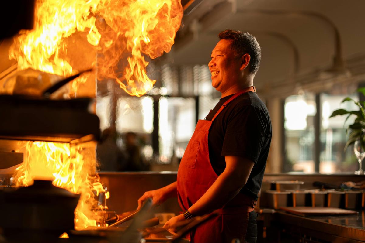 Terry Intarakhamhaeng cooking on the wok