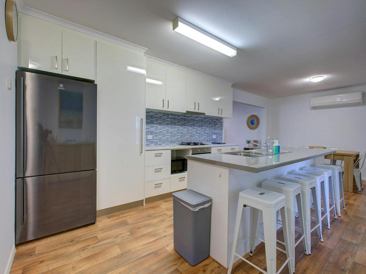 Bright modern kitchen with generous bench space and casual breakfast seating