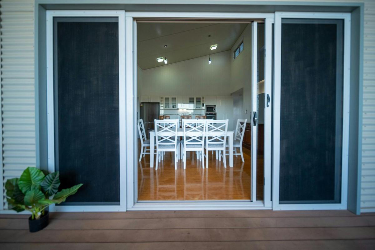 Sliding doors connect the deck to the dining area and kitchen.