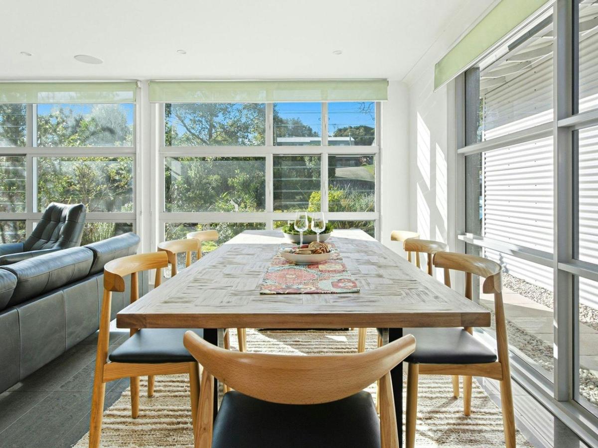 Gunggai | Dining area | Air conditioning | Highchair stored under stairs