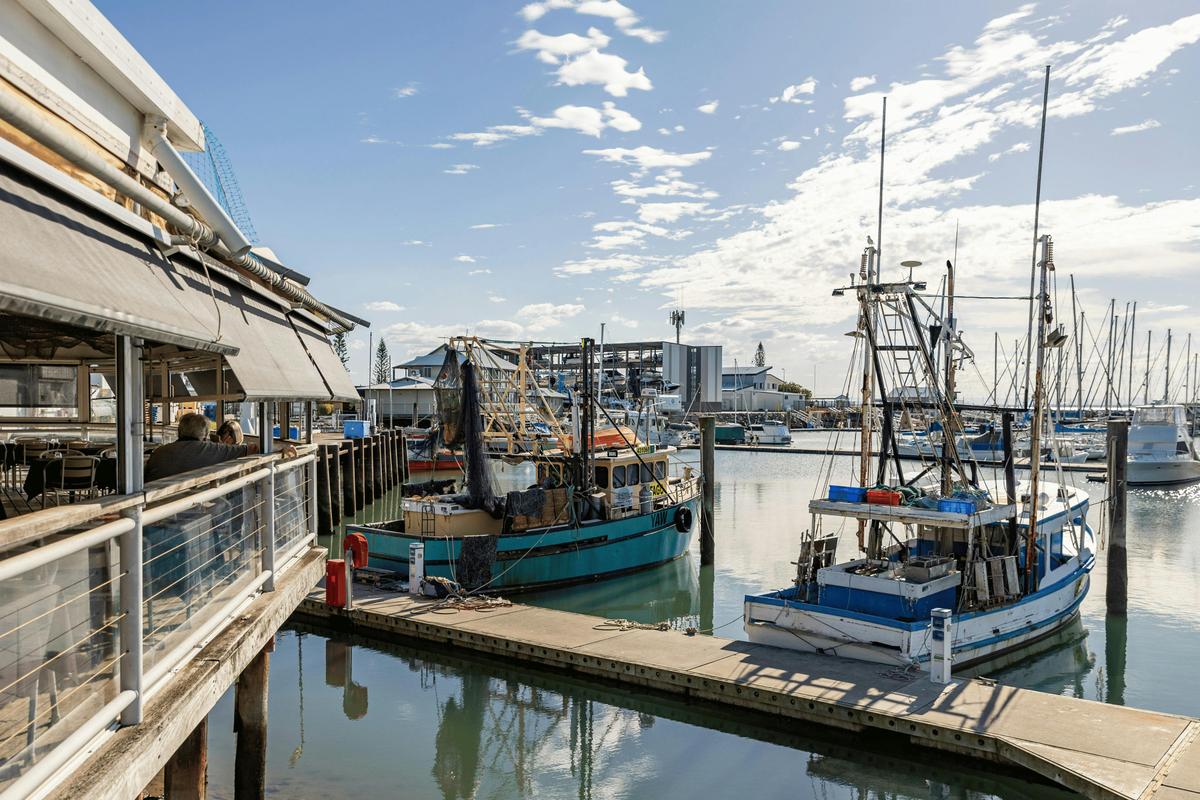 Tempest sits on the waterfront at Scarborough Harbour, surrounded by the working marina.