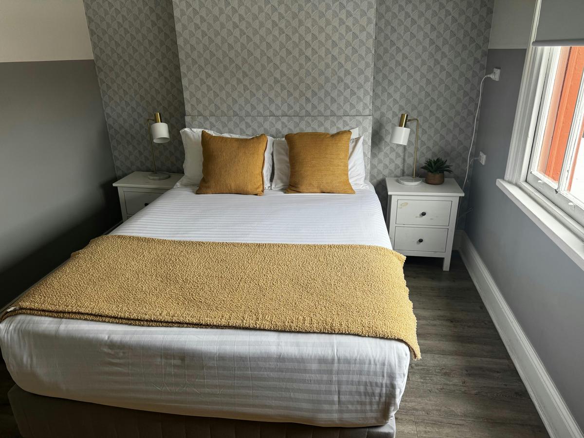 Light-filled boutique room at Native Rose Hotel.