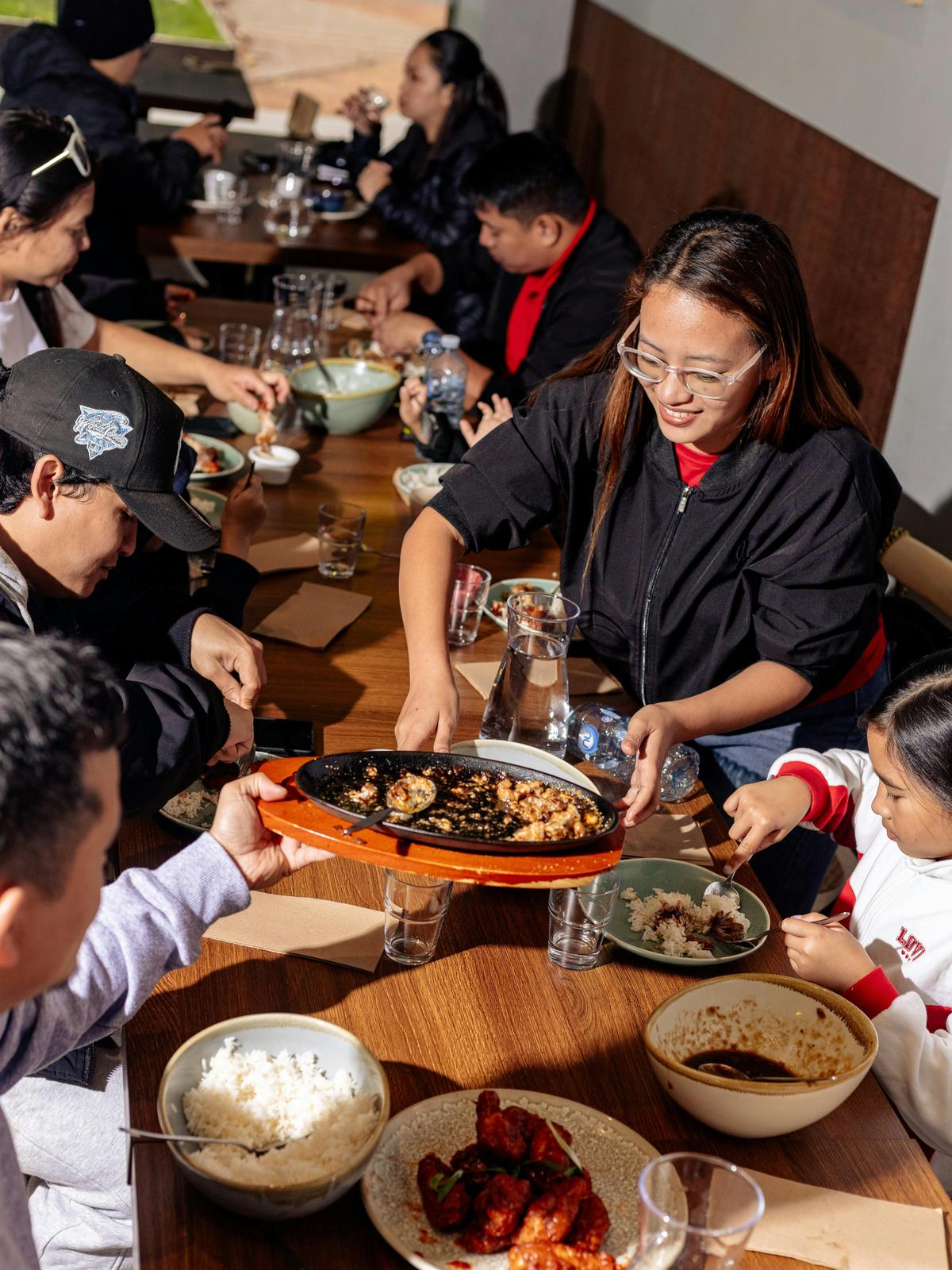 A shared Filipino meal that captures the Manila scene where food brings people together—stories shar