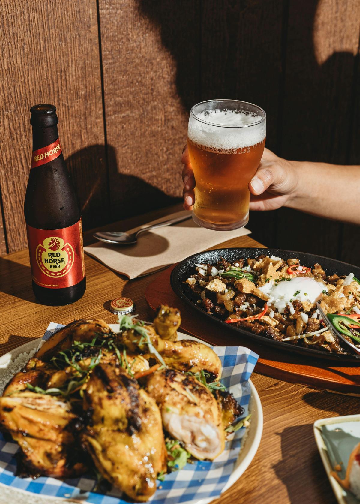 Filipino beers remain favourites across Manila, offering a taste of home in every pour. The sizzling