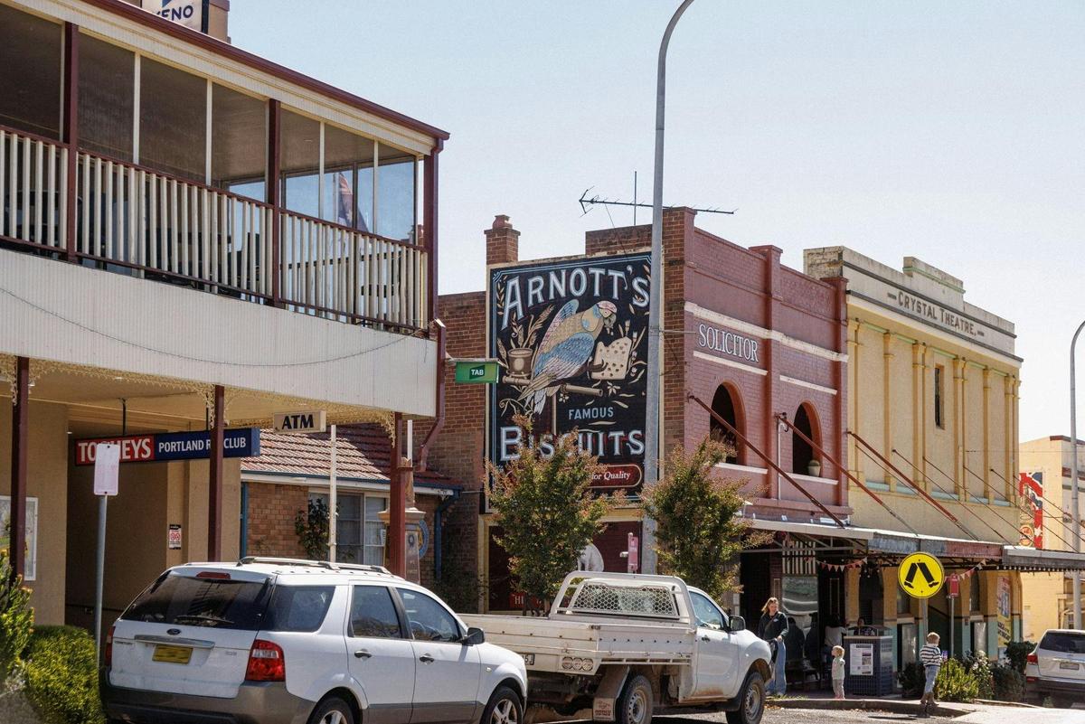 Wolgan Street Portland NSW with an Arnotts signwritten sign.