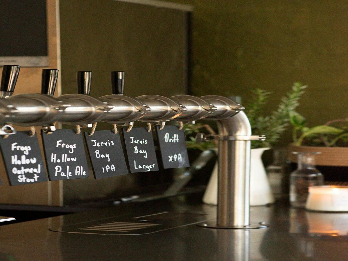 The photograph captures the inviting atmosphere of a contemporary brewery.