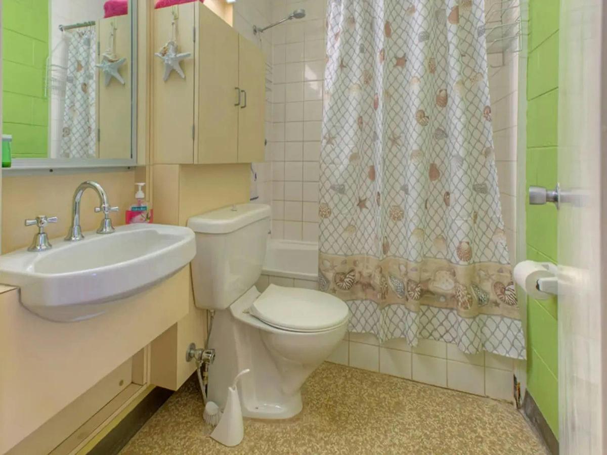 Full bathroom with a shower and tub combination, vanity, and storage