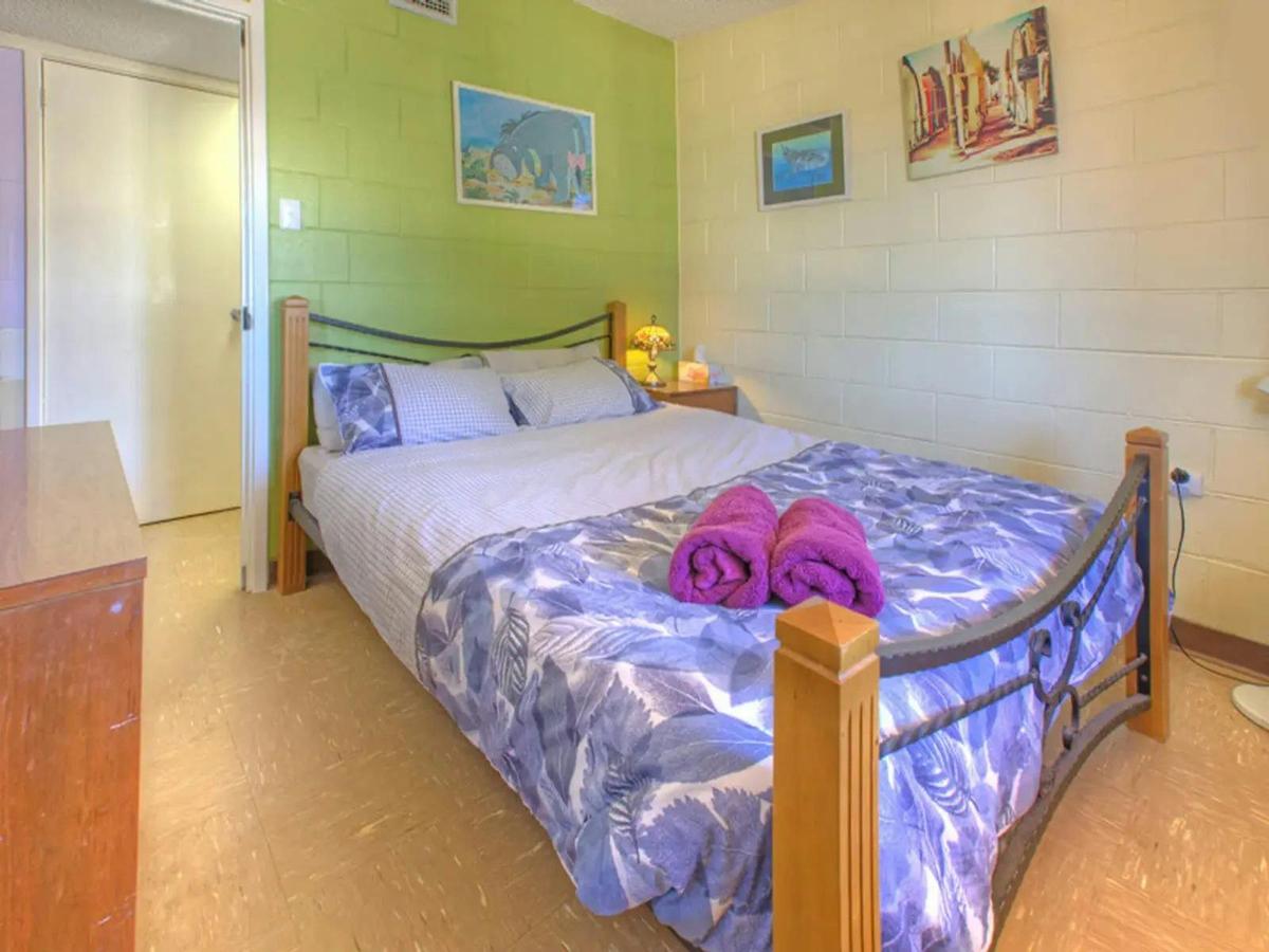 Comfortable bedroom with a queen bed, colorful decor
