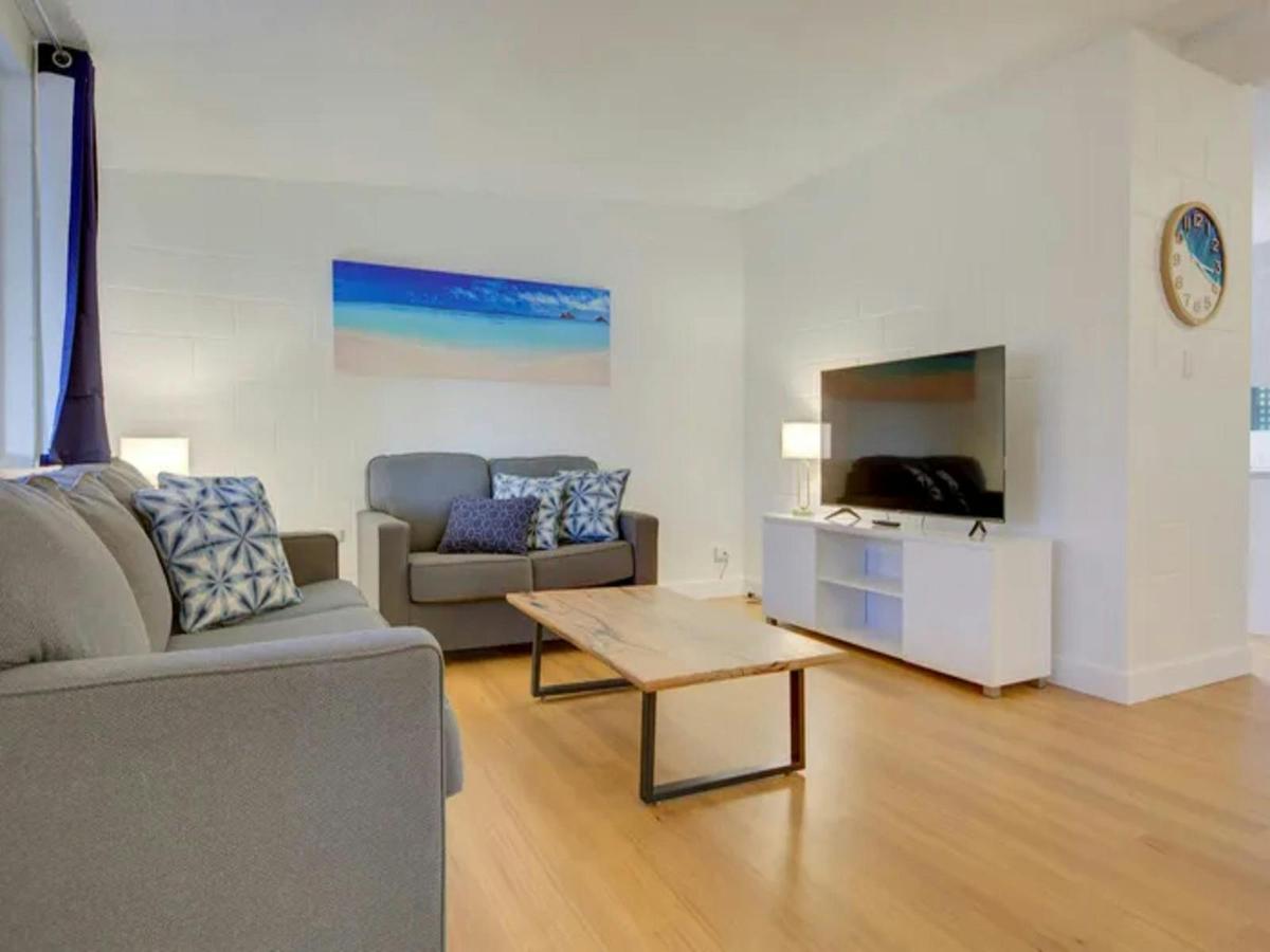 Comfortable living room with relaxed seating, television and coastal decor