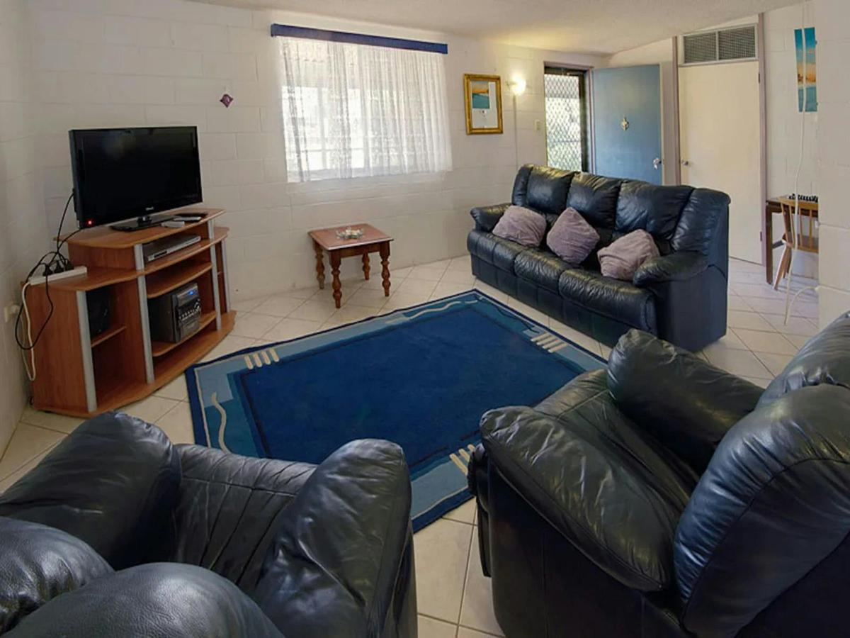 Comfortable living room with ample seating and a television