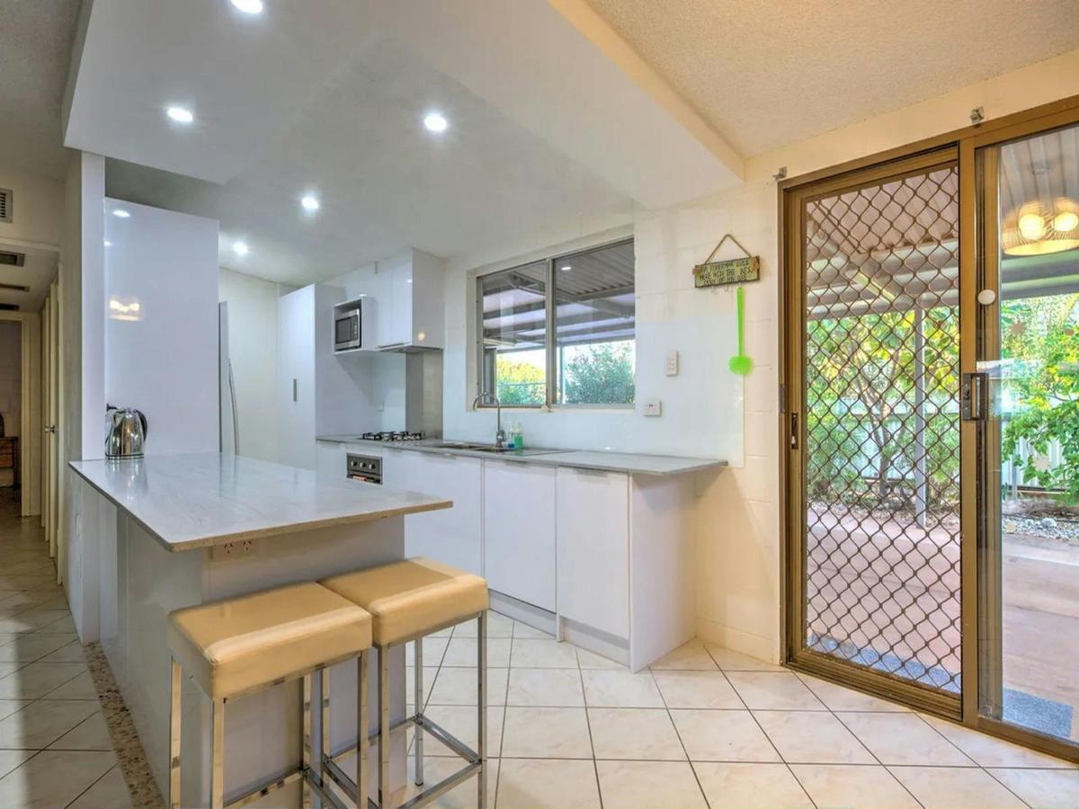Modern kitchen with generous bench space and easy access to the patio