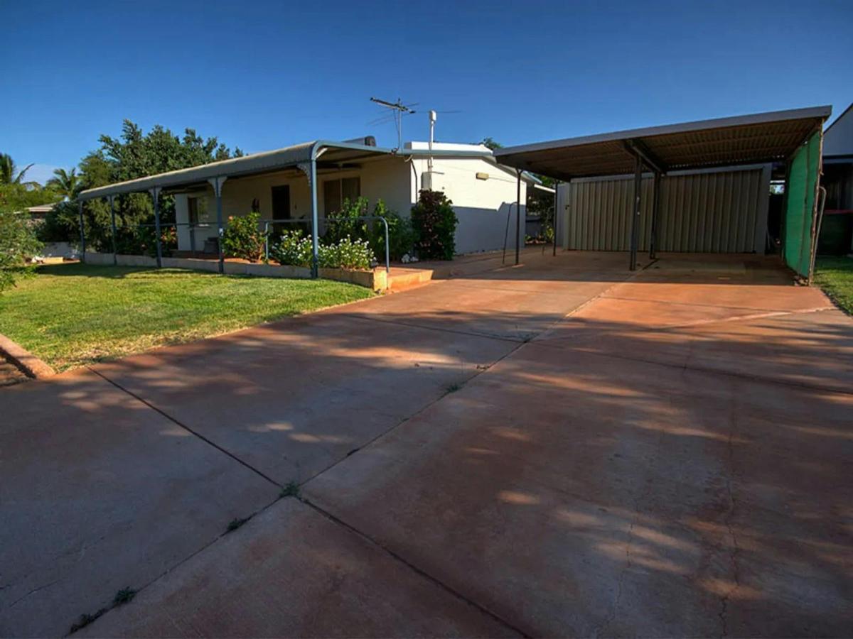 Spacious holiday home exterior with covered parking