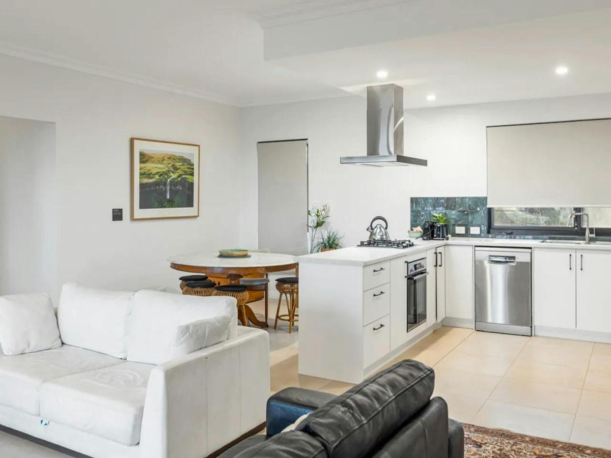 Bright open-plan kitchen and living area designed for relaxed group stays