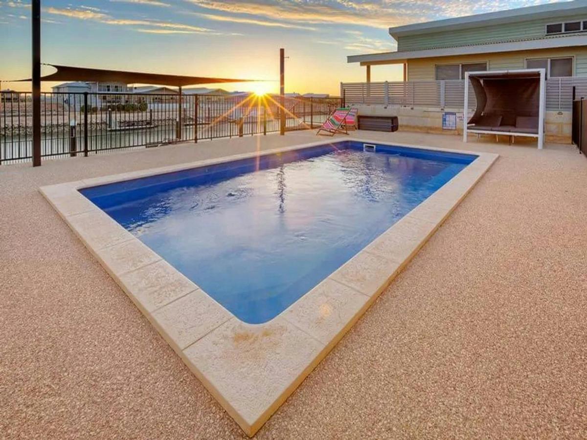 Private waterfront pool with relaxing sunset and marina views
