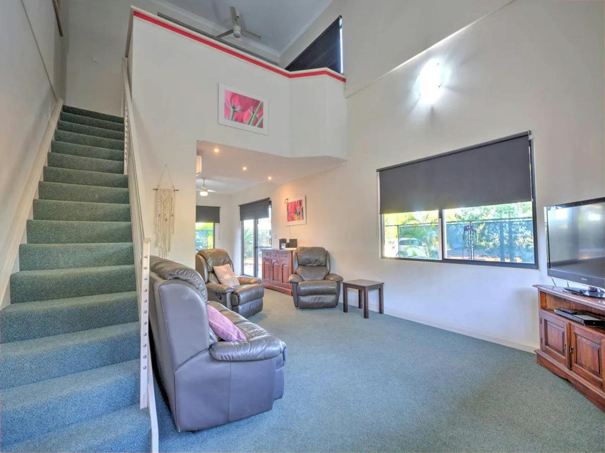 Spacious loft-style living room with comfortable seating and abundant light