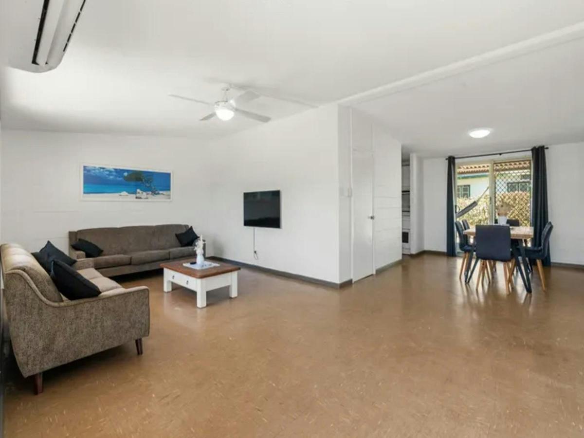 Spacious open-plan living and dining area with comfortable seating