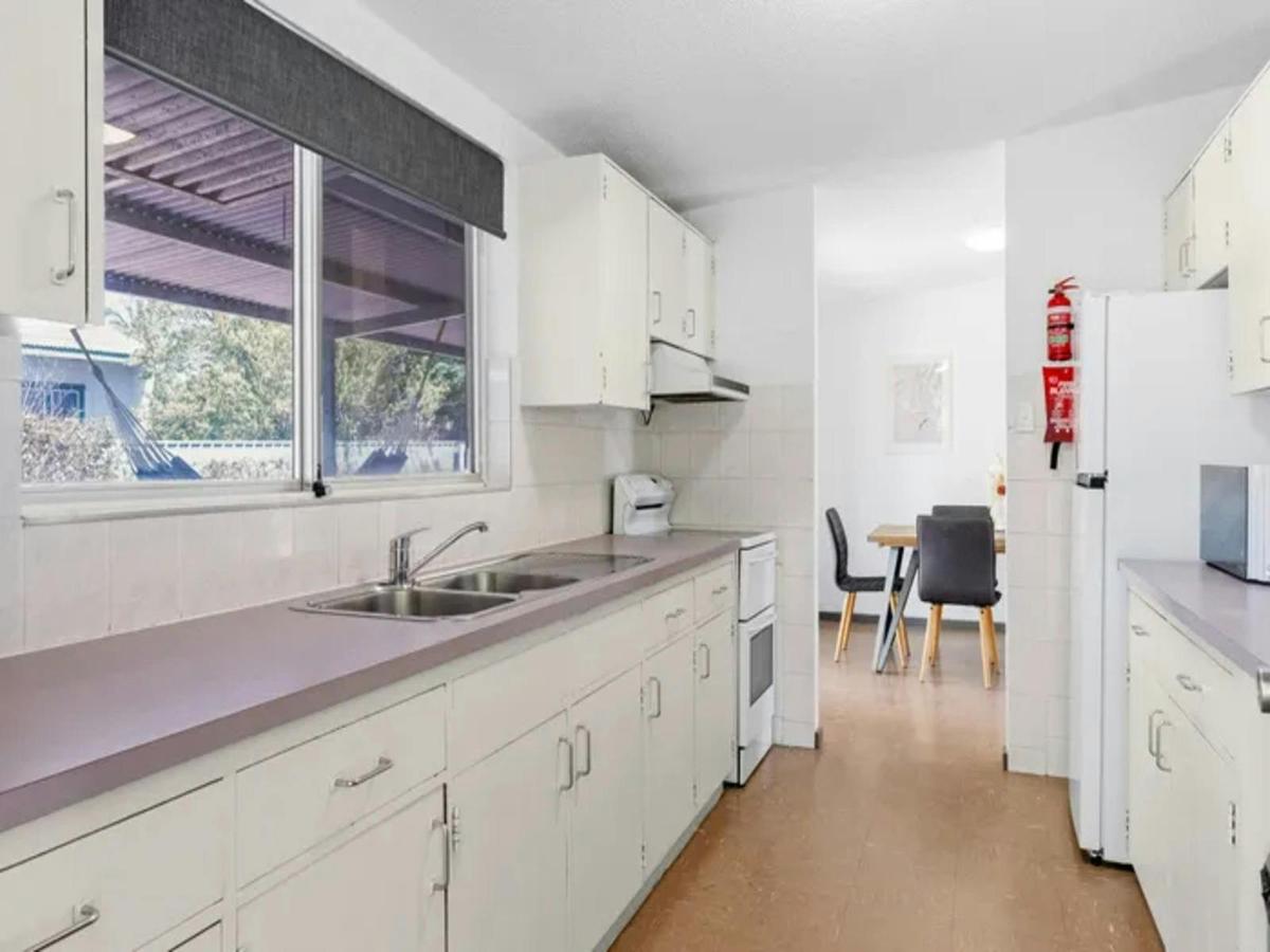 Practical kitchen with generous bench space and adjoining dining area