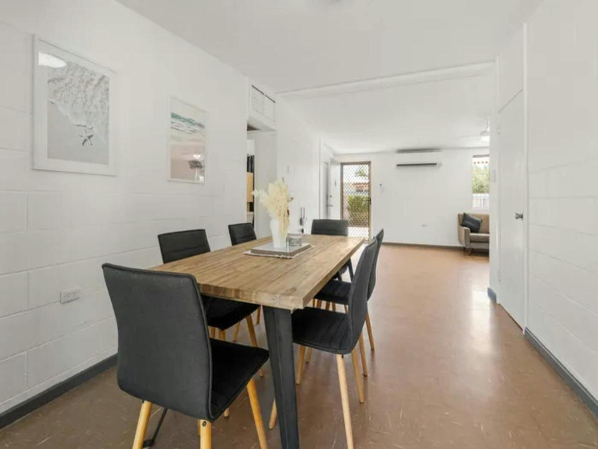 Bright dining area with seating for six and easy access to the living room