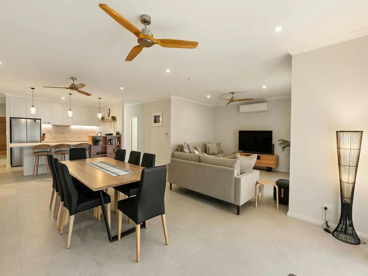 Spacious open-plan kitchen, dining and lounge area with modern furnishings
