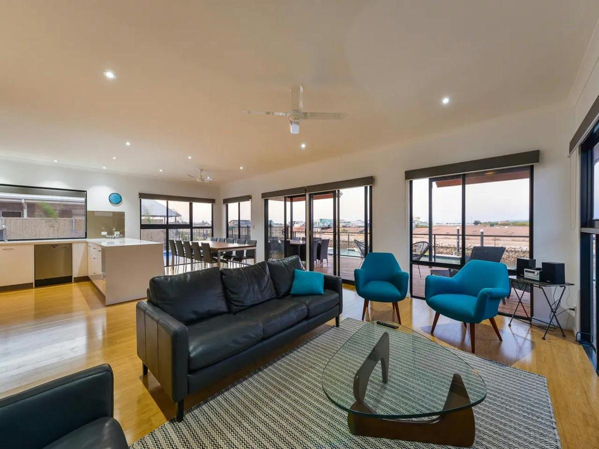 Spacious open-plan living area with panoramic waterfront views