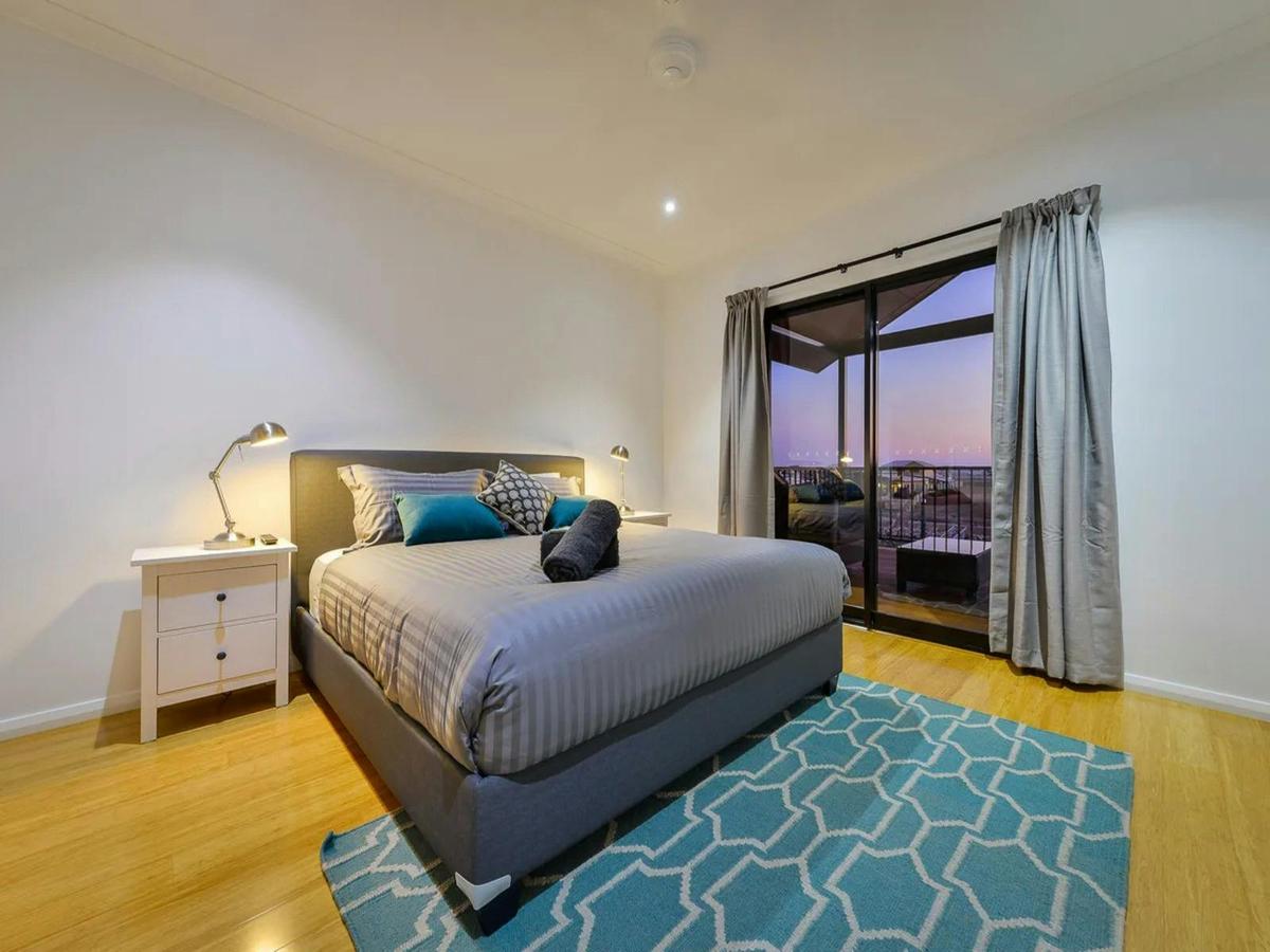 Relaxing queen bedroom with direct balcony access