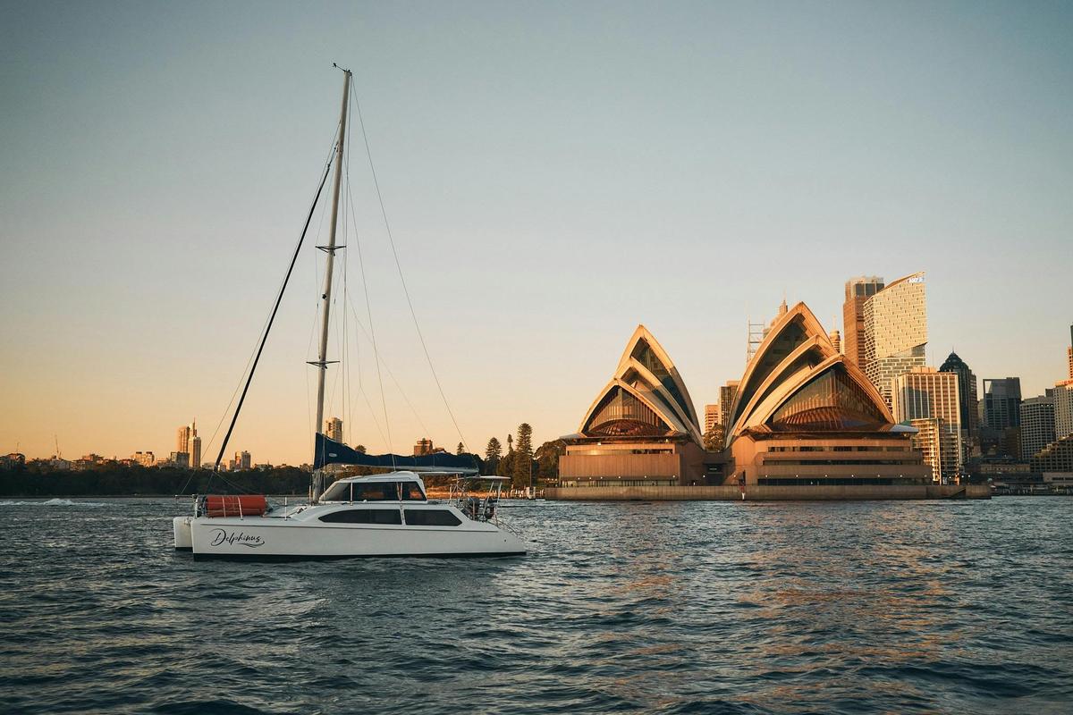 Delphinus catamaran on Sydney Harbour at sunrise with Sydney Opera House
