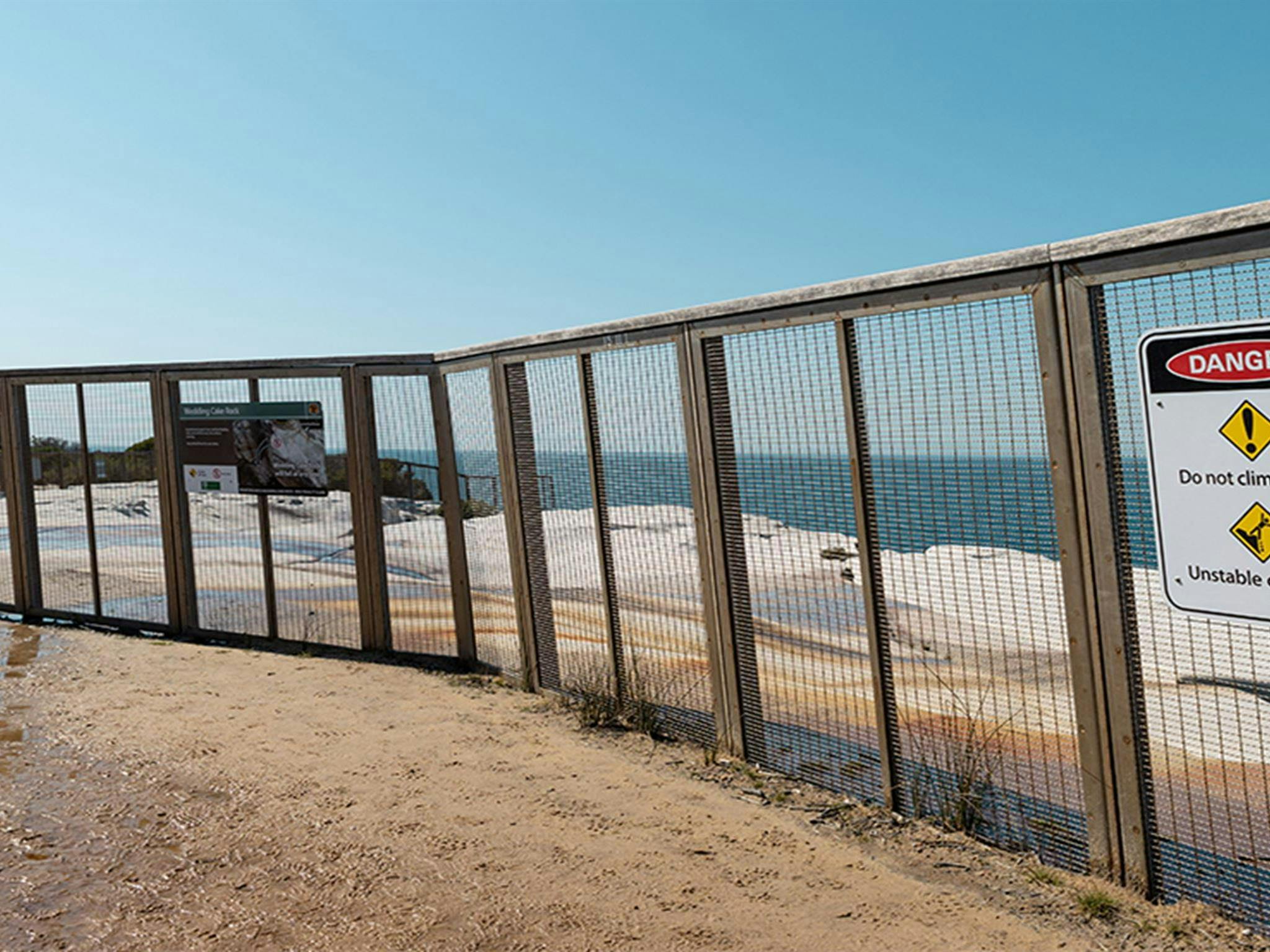 NPWS has had to build a large, permanent safety fence around Wedding Cake Rock in Royal National