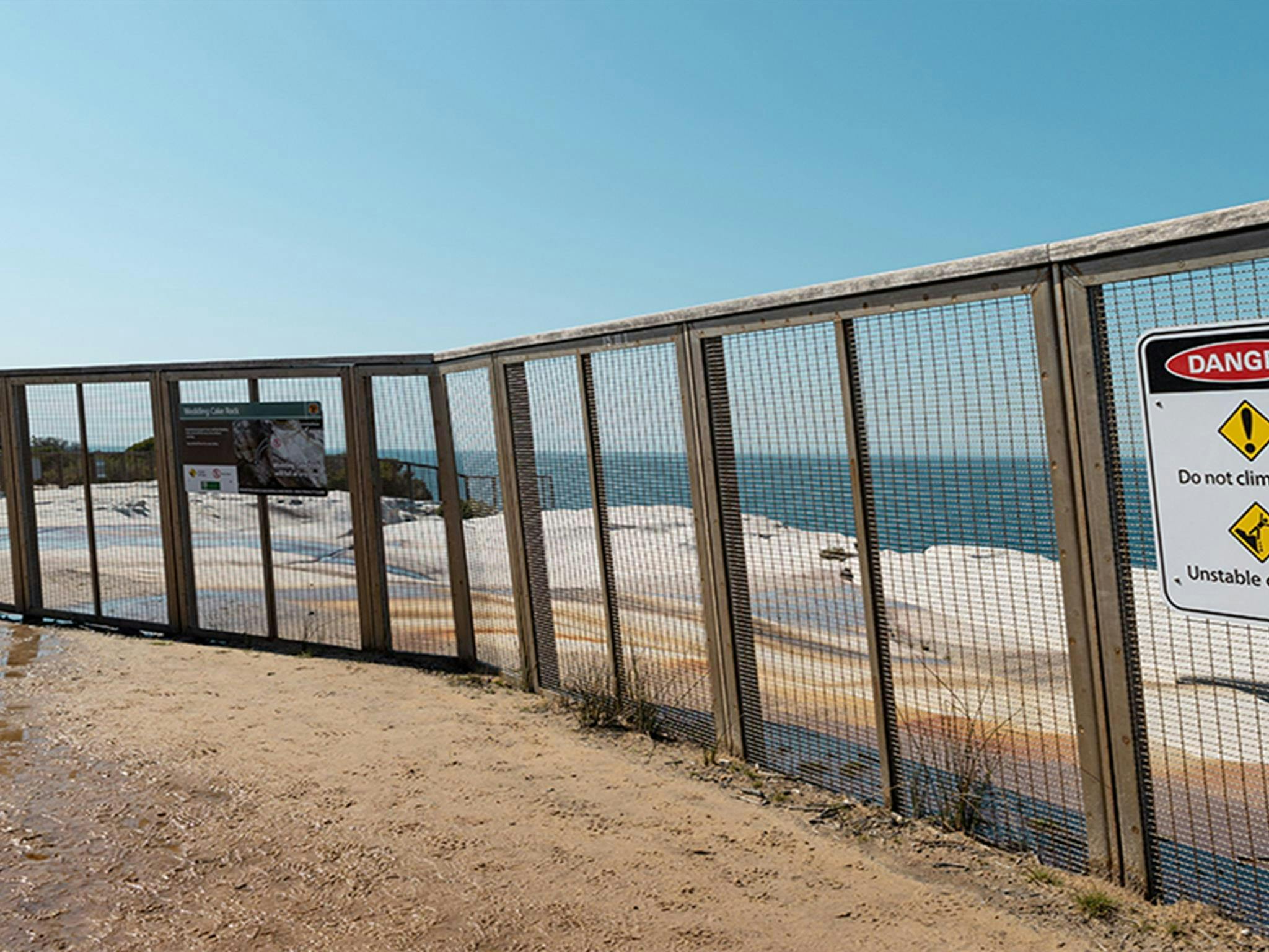 NPWS has had to build a large, permanent safety fence around Wedding Cake Rock in Royal National