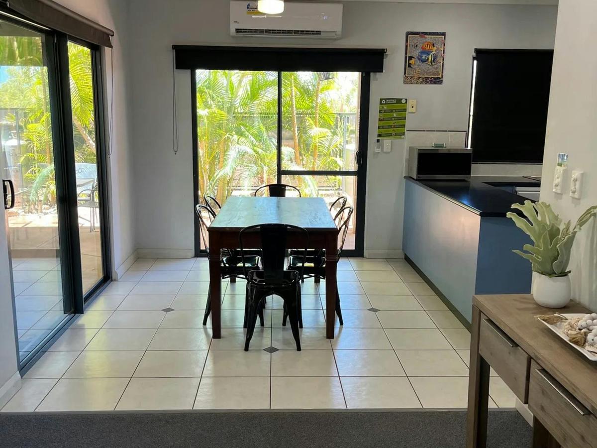 A bright dining area connects seamlessly with the kitchen and outdoor entertaining space