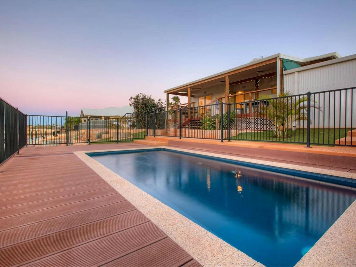 Enjoy a refreshing swim in the private pool surrounded by spacious outdoor decking