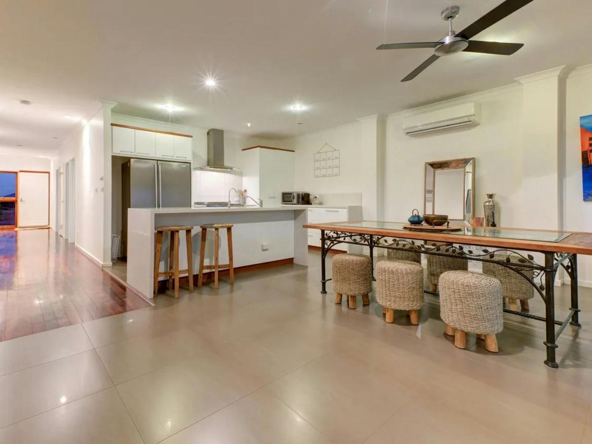 An open kitchen and dining area provides plenty of space for cooking, dining, and gathering